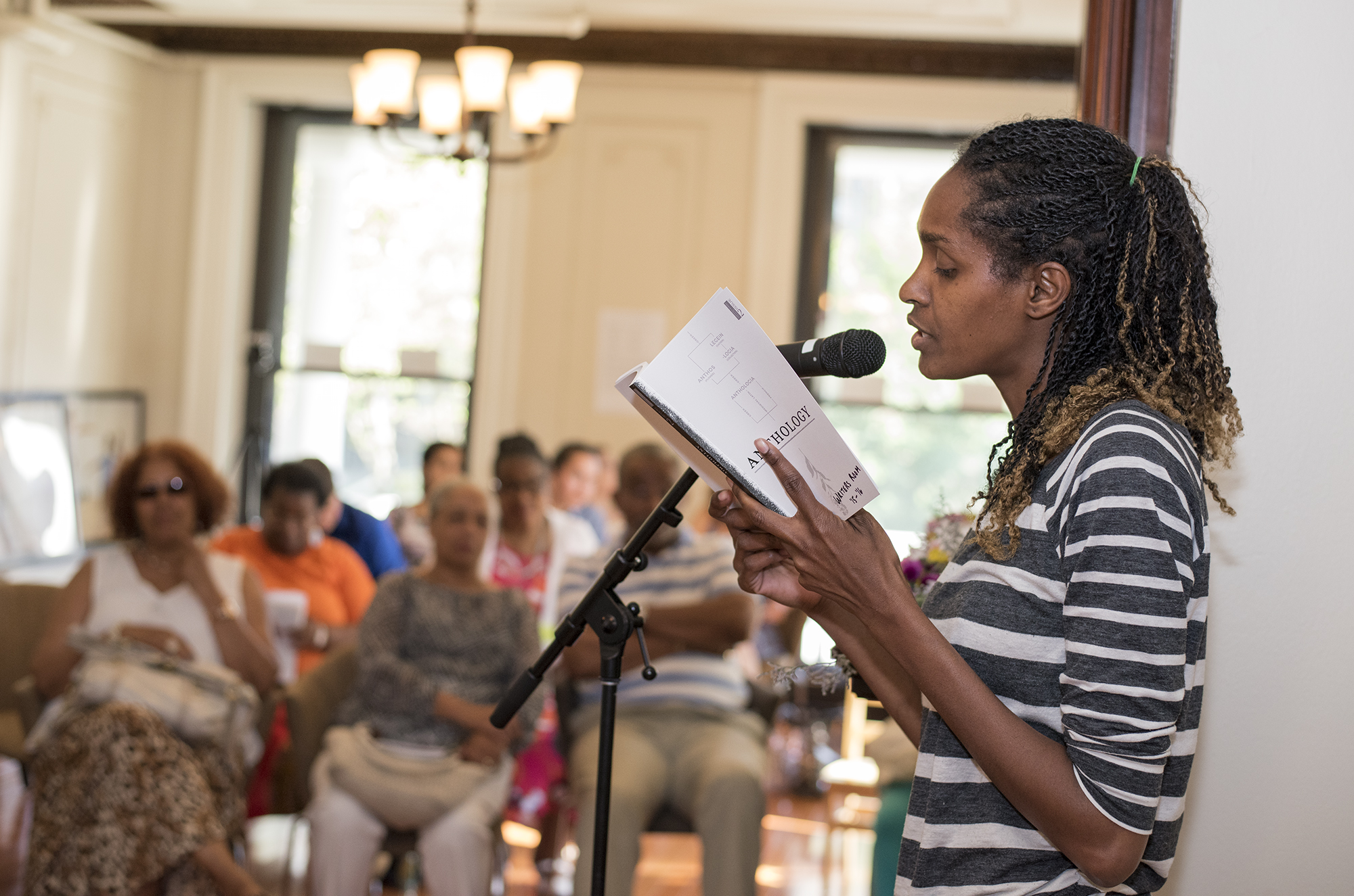 A Writers Room participant reads her work for the program's Anthology release event